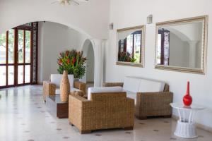 a living room filled with furniture and a window at San Martin Cartagena in Cartagena de Indias