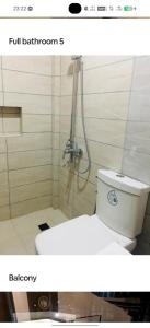 a bathroom with a toilet and a shower at Casa Junquera in Cebu City +9 photos