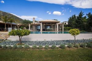 a house with a swimming pool in a yard at Βίλα Αοιδή in Galaxidi