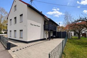 a white building with a sign on the side of it at The Günz Homes 1 in Günzburg
