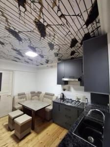 a kitchen with a painting on the ceiling at BridgeStayHostel in Samarkand +8 photos