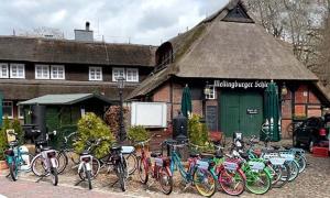 a group of bikes parked in front of a building at Kleinhuis Hotel Mellingburger Schleuse in Hamburg