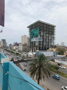 a view of a city with a large building at Faran Hotel in Karachi