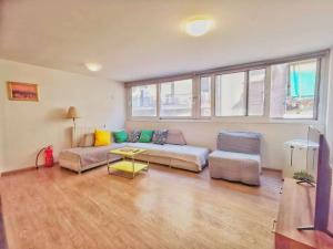 a living room with a couch and a table at Cozy & Modern Flat for 5 in Athens in Athens