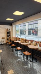 a row of tables and chairs in a restaurant at Hotel am Augustinerplatz in Cologne