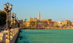 a body of water next to a city with buildings at Primo Piano in Sparano in Bari