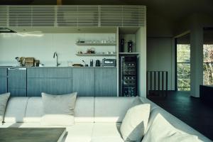 a living room with a couch and a kitchen at Hiire IZU OLIVE in Ito +18 photos