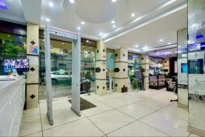 a room with glass doors and a car dealership at Hotel Shivdev International, near New Delhi Railway Station & City Centre in New Delhi