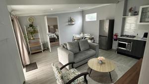 a living room with a couch and a table at 13 on Newington in Gqeberha