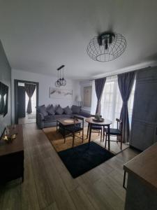 a living room with a couch and a table at ApuLux Apartments in Alba Iulia