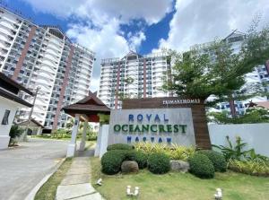 a sign for the royal olympichurst hotel at The Crib at Royal Oceancrest Mactan in Lapu Lapu City