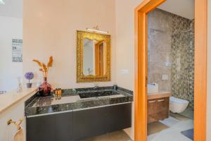 a bathroom with a sink and a mirror at Villa moderne à 5 min de la plage avec jardin et 3 salons in Essaouira +29 photos