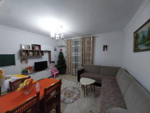 a living room with a couch and a table at Refika in Berat