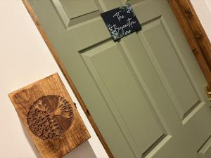 a door with a sign on it with a heart on it at True Lovers Knot, Tarrant Keyneston in Tarrant Keynston