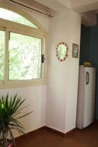 a room with a window and a refrigerator at Tecoma studios Lighthouse in Dahab +47 photos