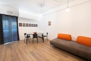a dining room with a table and chairs in a room at Ospitalità Il Prato in Iesi +26 photos