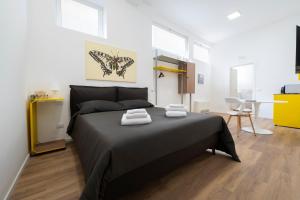 a bedroom with a bed with two towels on it at Ospitalità Il Prato in Iesi