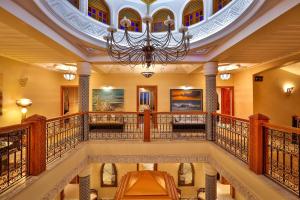 a large lobby with a chandelier and a staircase at Palais Amador in Oulad Mazoug