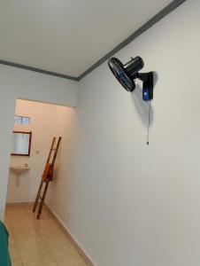 a room with a hair dryer on a wall at Tetebatu Fullmoon in Tetebatu