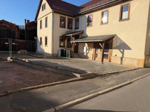 a building with awning on the side of a street at Deer Lounge in Bad Liebenstein