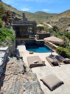 a house with a swimming pool and a building at Kydippi Kea Villa in Korissia