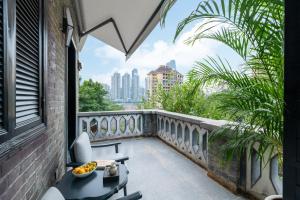 a balcony with a view of the city at La MAISON Banshan in Chongqing