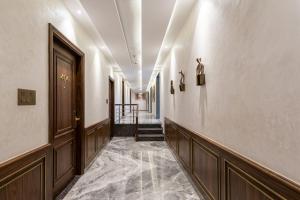 a corridor of a building with a hallway at Hotel Savera Amritsar Near Golden Temple in Amritsar