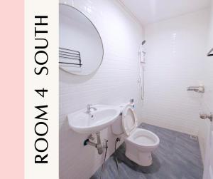 a bathroom with a sink and a toilet and a mirror at Proud Room &wifi 2 in North Pattaya +34 photos