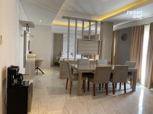 a dining room with a table and chairs at Front One The Andia Boyolali in Boyolali