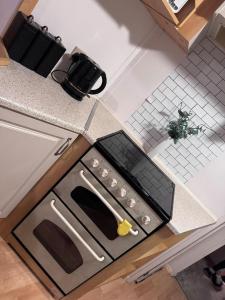 a stove top oven sitting on top of a kitchen counter at Caravan in Chapel Skegness in Chapel Saint Leonards
