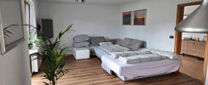 a living room with a couch and a table at Quartier Levi in Oberhausen