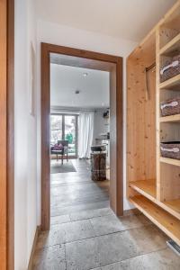 a hallway with a door leading to a living room at Mountain Lodge in Lenggries