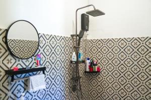 a bathroom with a mirror and a sink at Aman House in San Vicente +28 photos