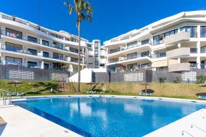 a swimming pool in front of a apartment building at Hollywood A111 in Mijas Costa