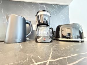 two appliances sitting on top of a kitchen counter at Astrid Deluxe in Novalja