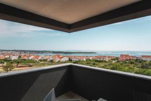 a balcony with a view of the ocean at Astrid Deluxe in Novalja