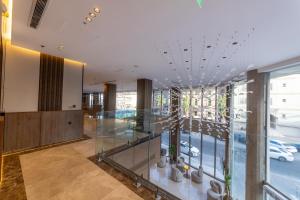a lobby of a building with a view of a street at Mora Hotel in Jeddah