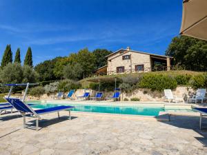 a villa with a swimming pool and a house at Scappo in Umbria, La dolce Godera in Lugnano in Teverina