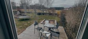 a view of a patio with chairs and a table at Snäckstrand Guesthouse in Färjestaden +3 photos