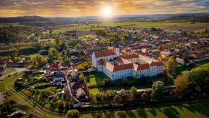 an aerial view of a town with a large building at Klášter Nová Říše in Nová Říše