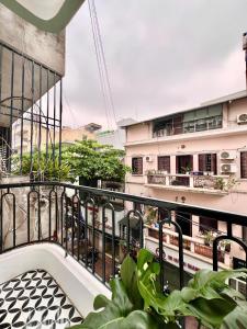 a balcony of a building with plants at Aurora Homestay in Hanoi