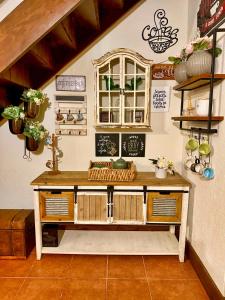 a room with a counter with a window and shelves at Casa Del Cielo in Jarabacoa