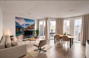 a living room with a couch and a table at The Residence Enschede in Enschede