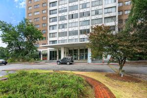 a car parked in front of a large building at Prime Location 1BR Near Top Attractions & Stadiums with Free Parking-1204 in Atlanta