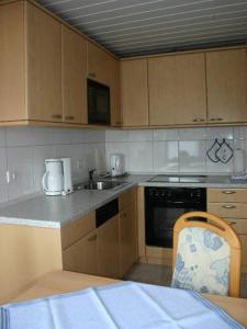a kitchen with a sink and a counter top at Pidder Lyng - FW 3 in Utersum