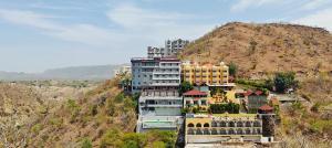 a group of buildings on top of a hill at RUDRAKSH HOTEL & RESTAURANT in Kumbhalgarh in Kumbhalgarh