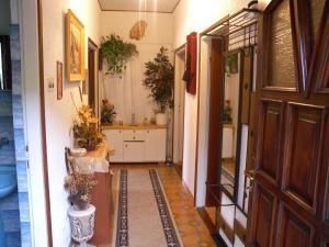 a hallway of a house with a door and a bathroom at Apartment Jablanac 1 in Jablanac