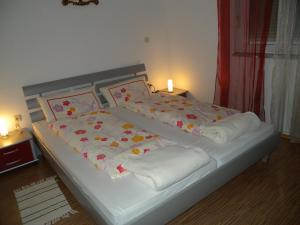 a bed in a room with two pillows on it at Apartment Liznjan 2 in Ližnjan