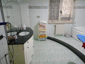 a bathroom with a sink and a bath tub at Masseria Sant' Anna in Cerreto Sannita