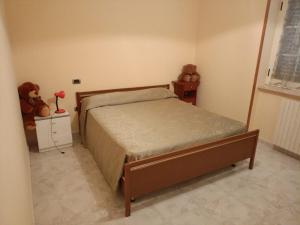 a bedroom with a bed and two teddy bears at Masseria Sant' Anna in Cerreto Sannita +16 photos